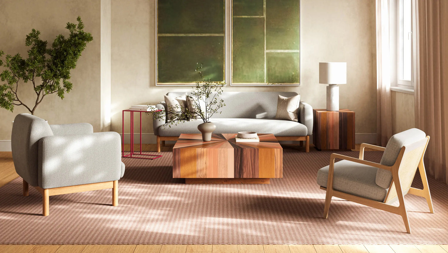 Layered living room with a sofa, two accent chairs and a sculptural wood coffee table