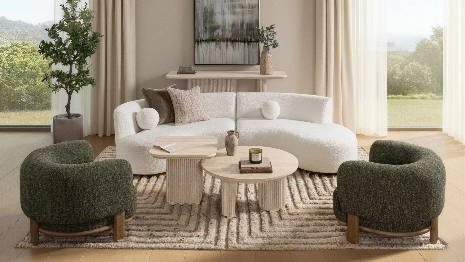Cozy living room with a white curved sofa, round wooden coffee table, two green armchairs, a patterned rug, and large windows overlooking a scenic view.