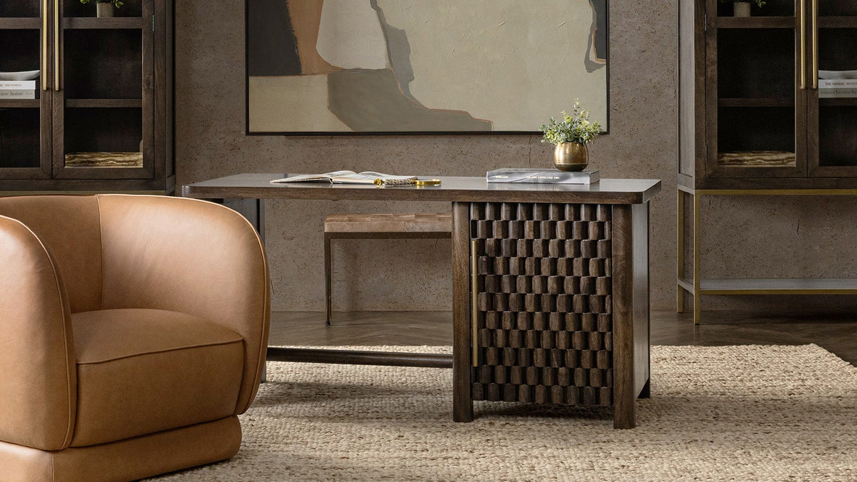 Mango wood desk with hidden storage styled between tall cabinets in a warm modern office