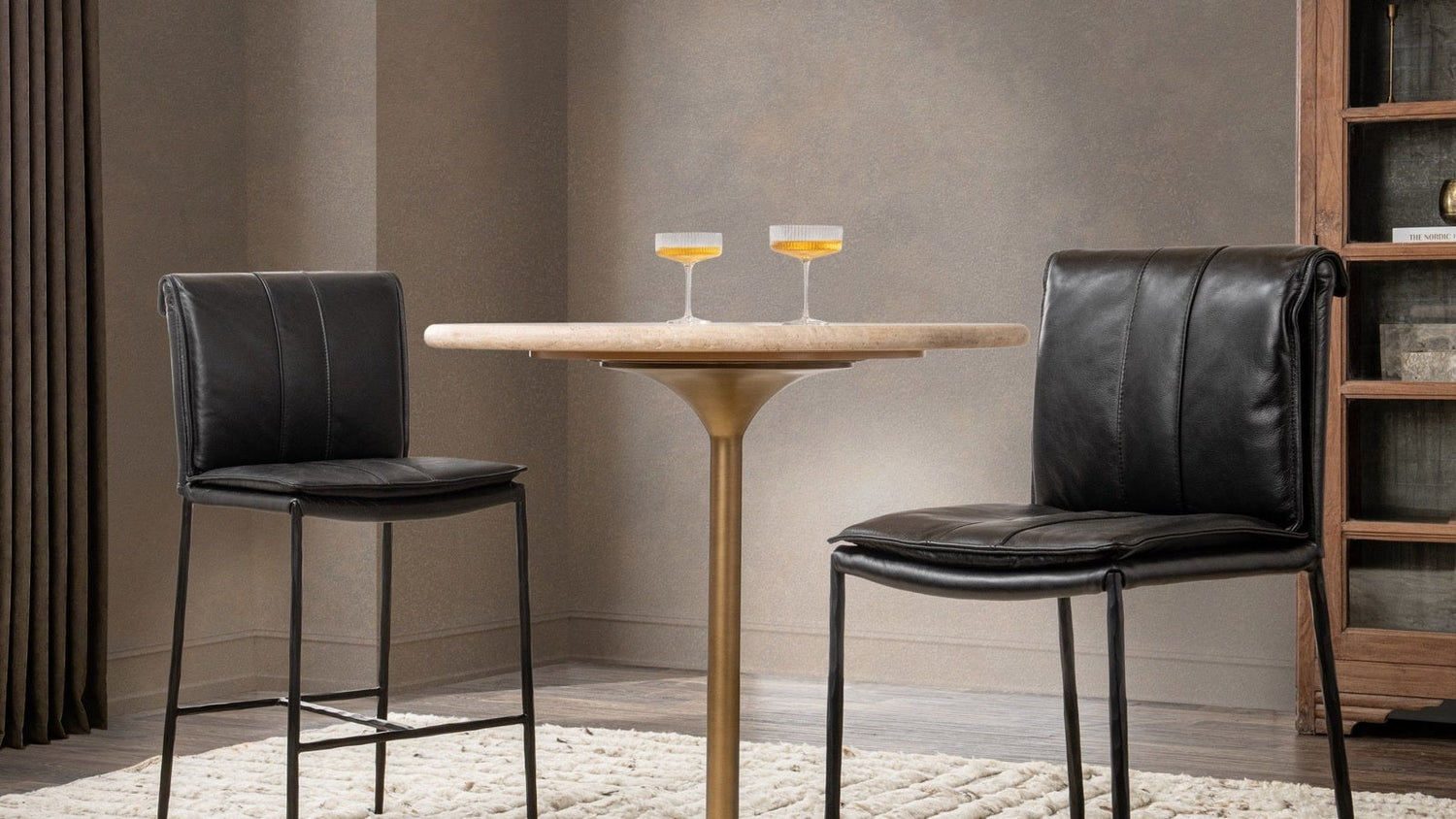Counter-height table styled in a dining nook with stools