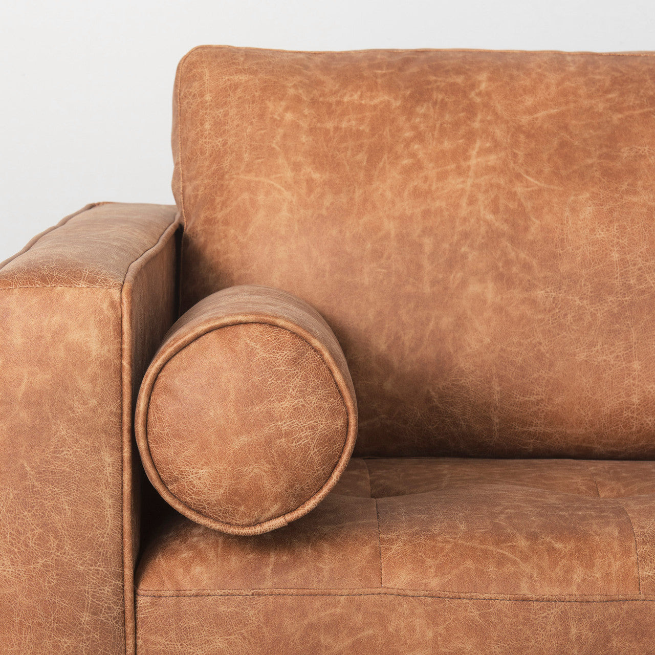 Loretta 88.0L x 36.2W x 33.9H Cognac Brown Faux Leather Three Seater Sofa with Two Bolster Cushions