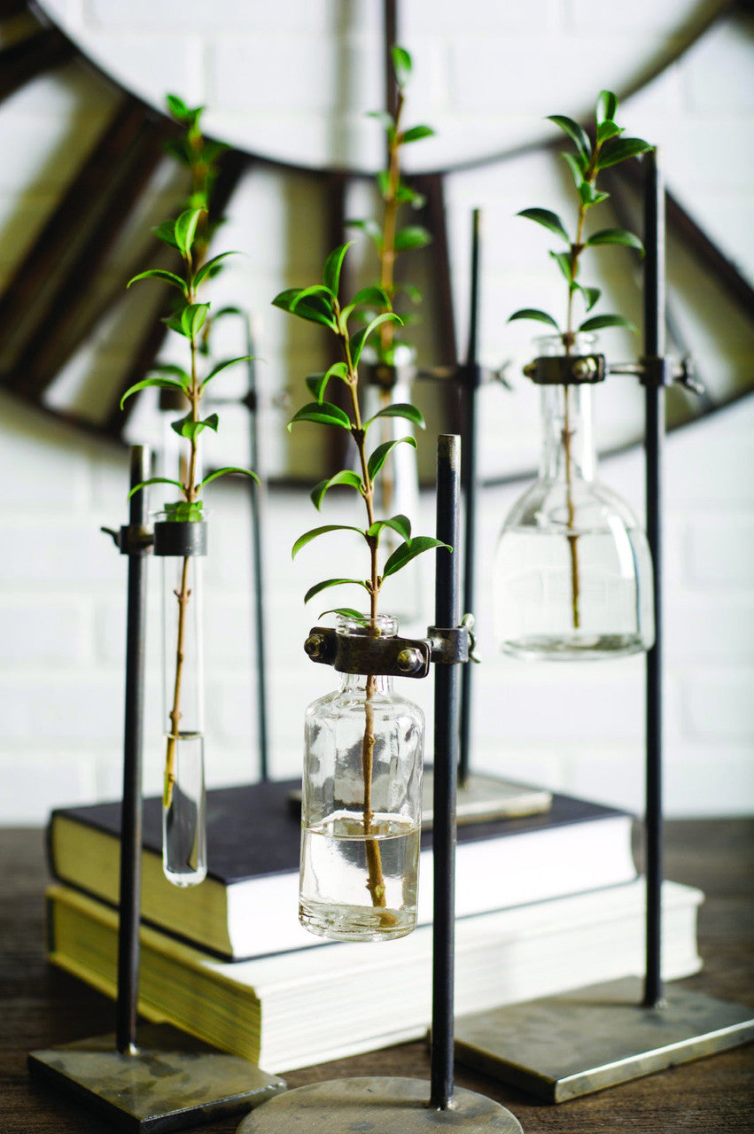 Jarvis Set of Five Dark Brown Metal and Glass Chemistry Inspired Bottles