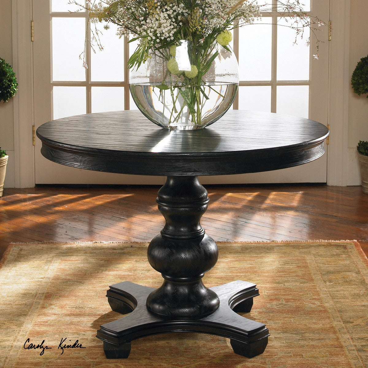 Brynmore black round pedestal accent table 42"