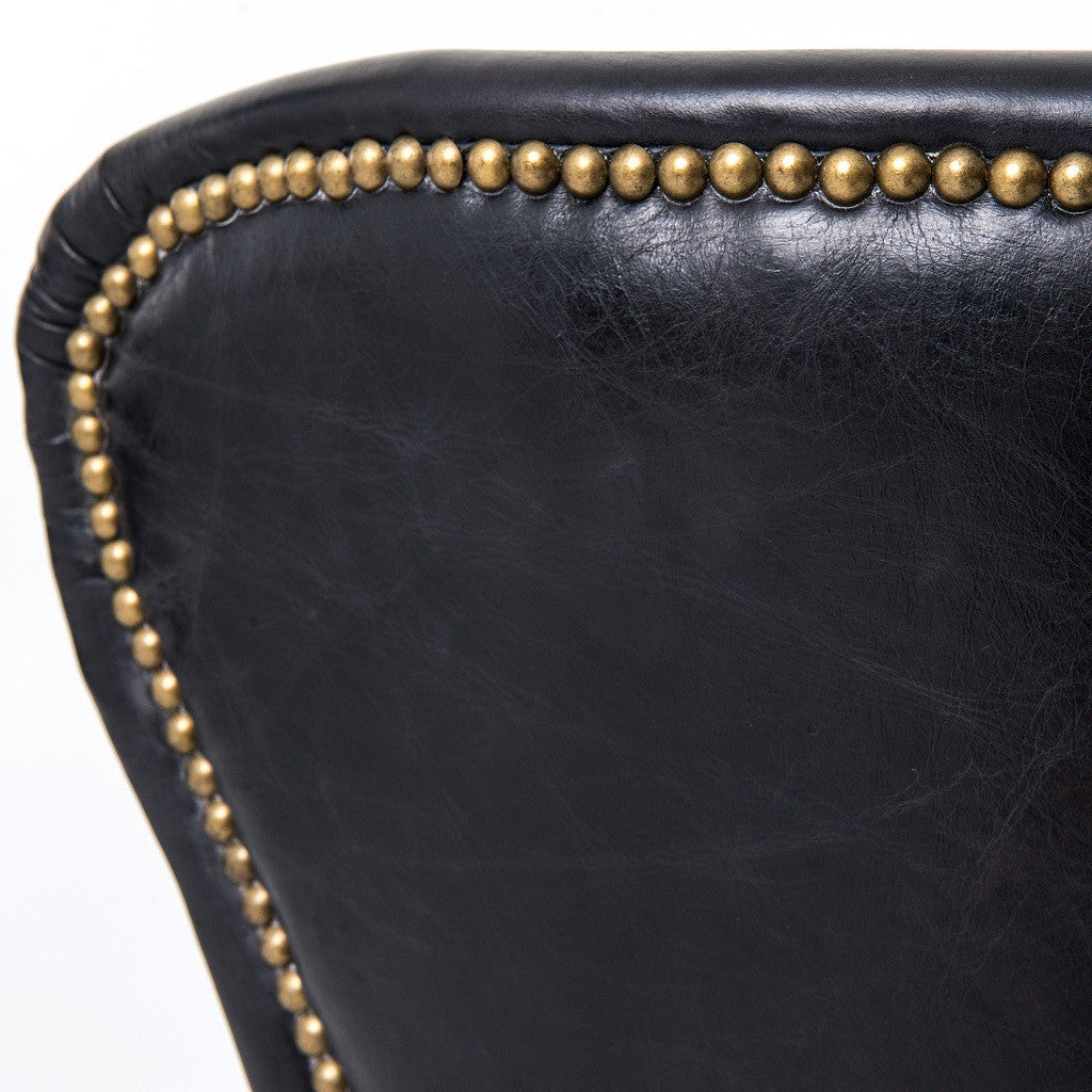 Black leather dining chair with nailheads