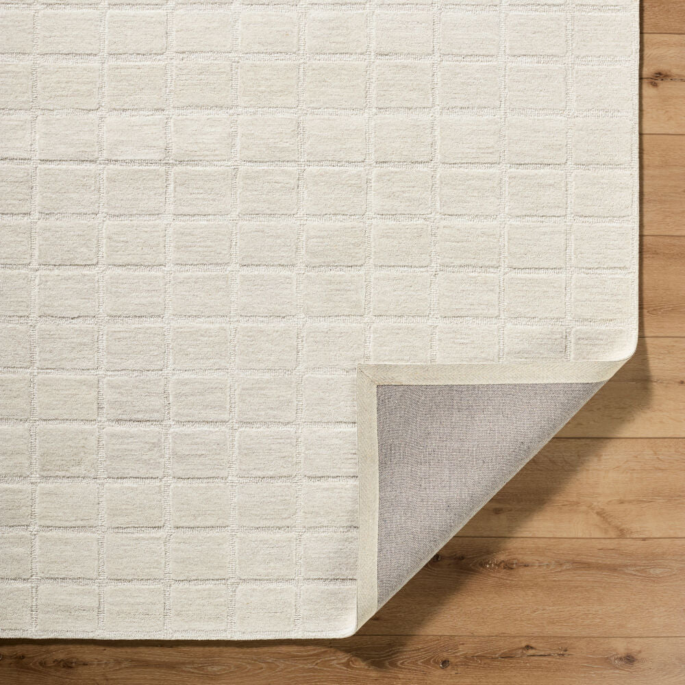 Benchcraft Light Beige Handmade Rug - fold