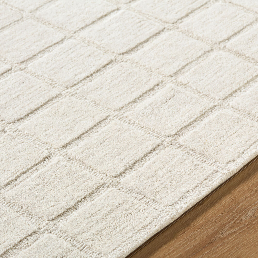 Benchcraft Light Beige Handmade Rug - texture