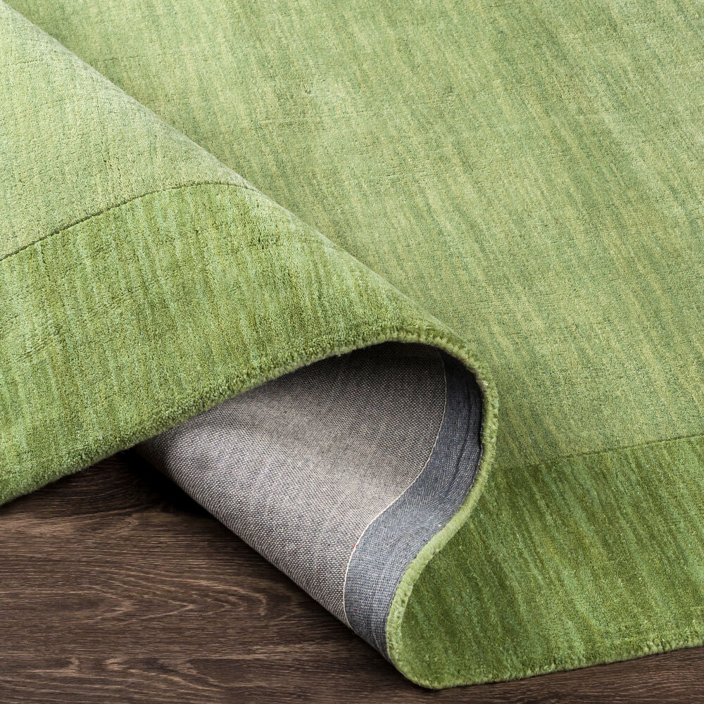 Mystique Medium Green Handmade Rug - fold